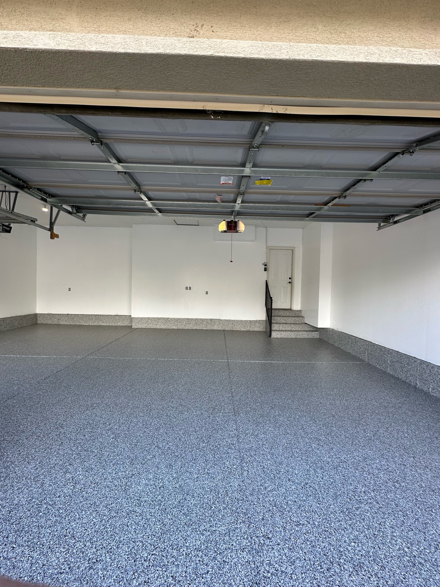 Blue-gray flake floor coating in two car garage Utah