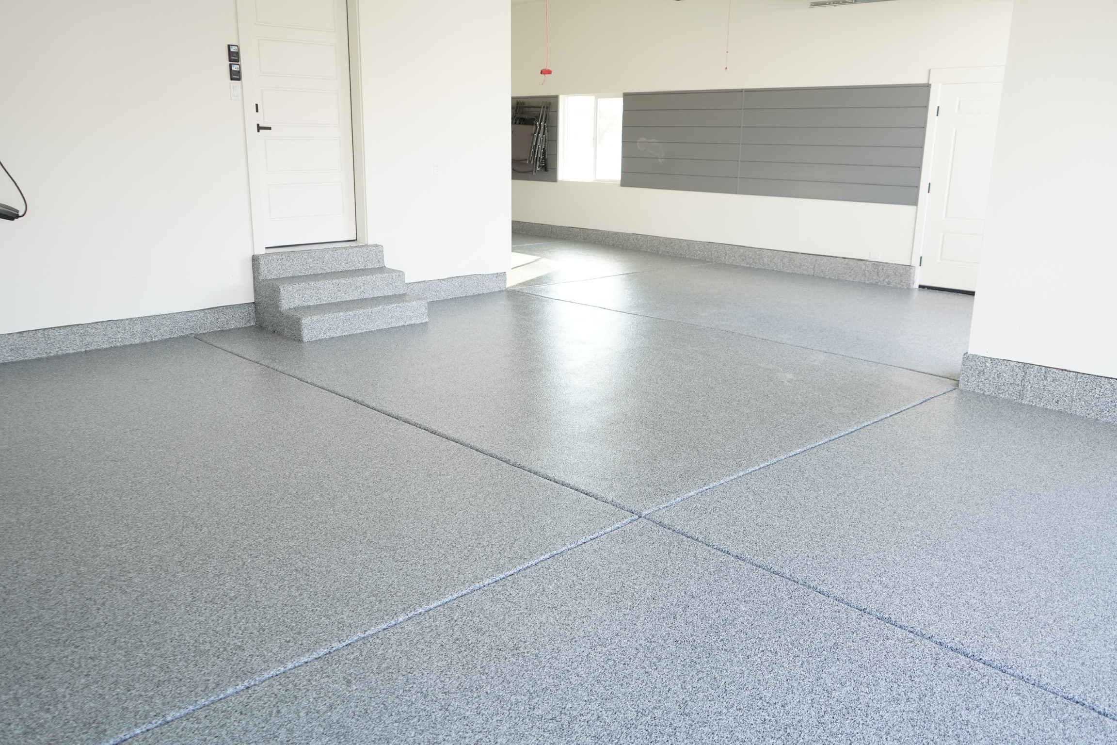 Clean gray floor coating with coated steps and cove base Utah